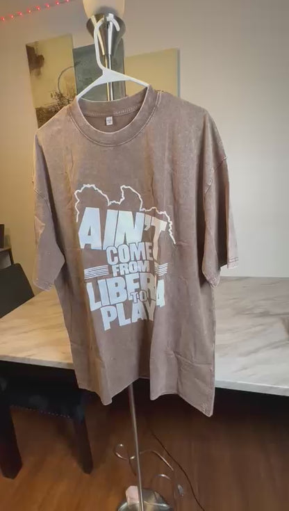 Liberian clothing brand  African heritage streetwear  Custom printed t-shirts and mugs  Ain’t Come From Liberia To Play shirt